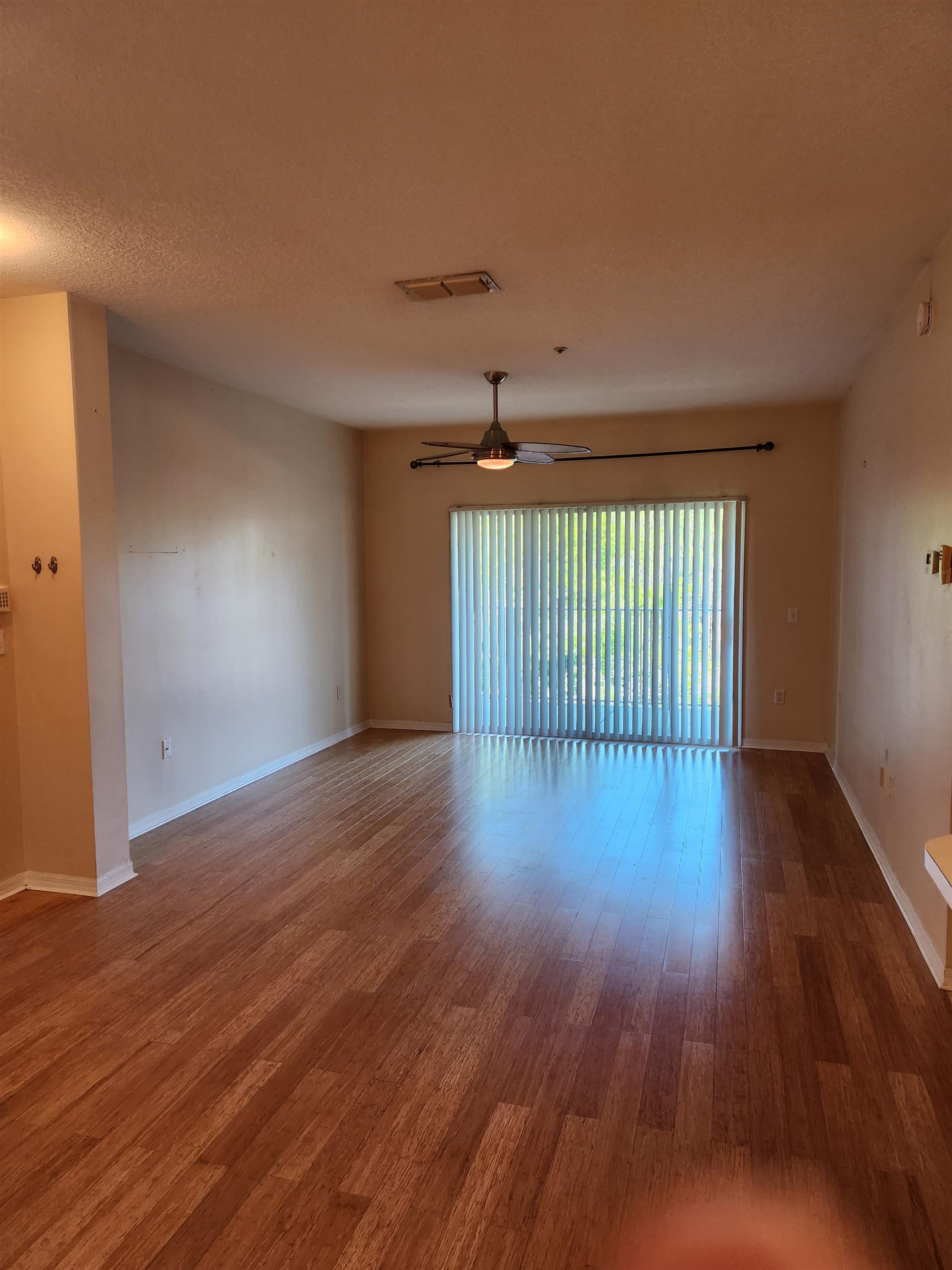 510 Florida Club Boulevard, Unit 304 St. Augustine, FL 32084 - Photo 5 of 24 a view of a livingroom with wooden floor
