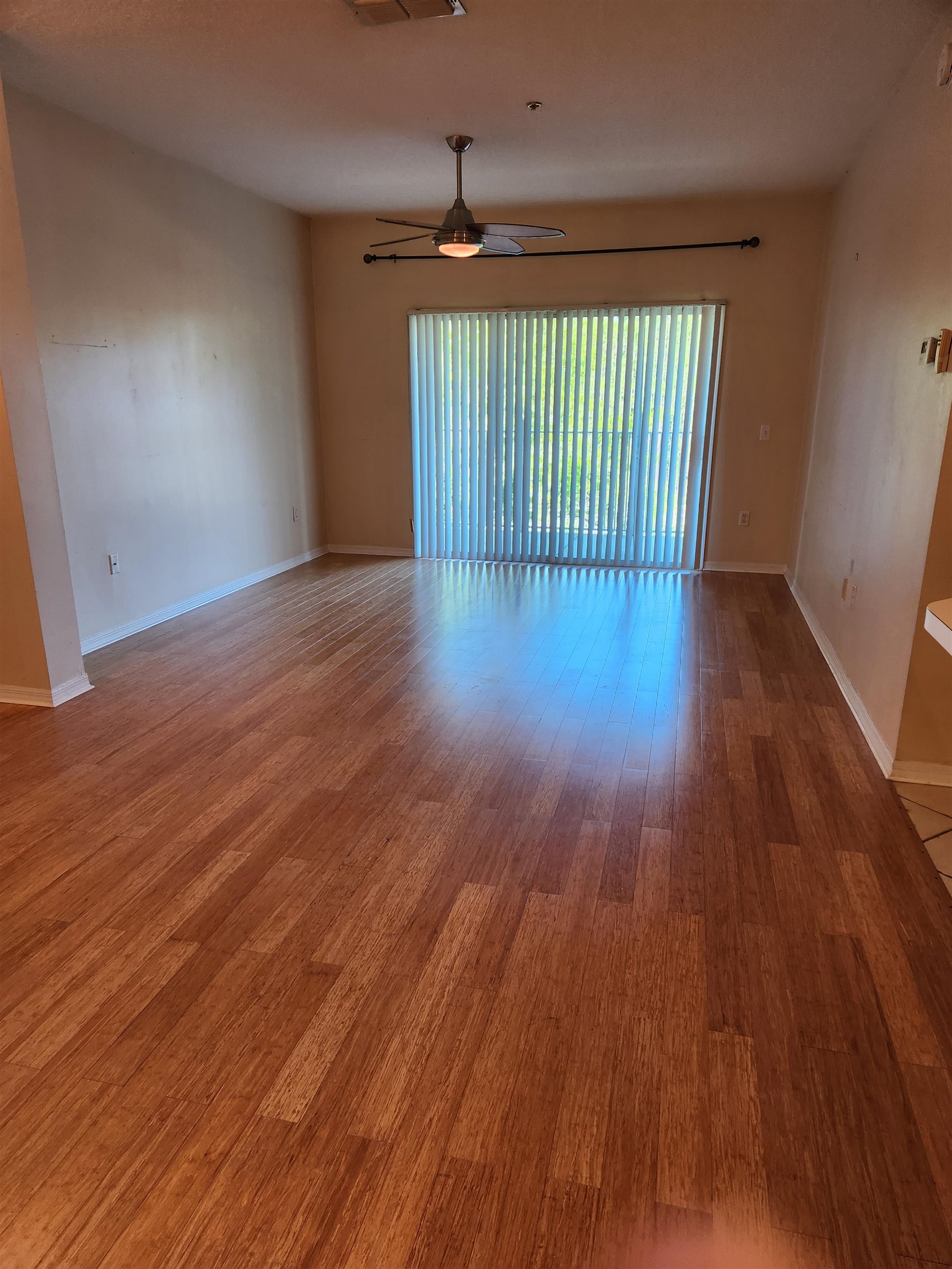 510 Florida Club Boulevard, Unit 304 St. Augustine, FL 32084 - Photo 6 of 24 wooden floor in an empty room with a window
