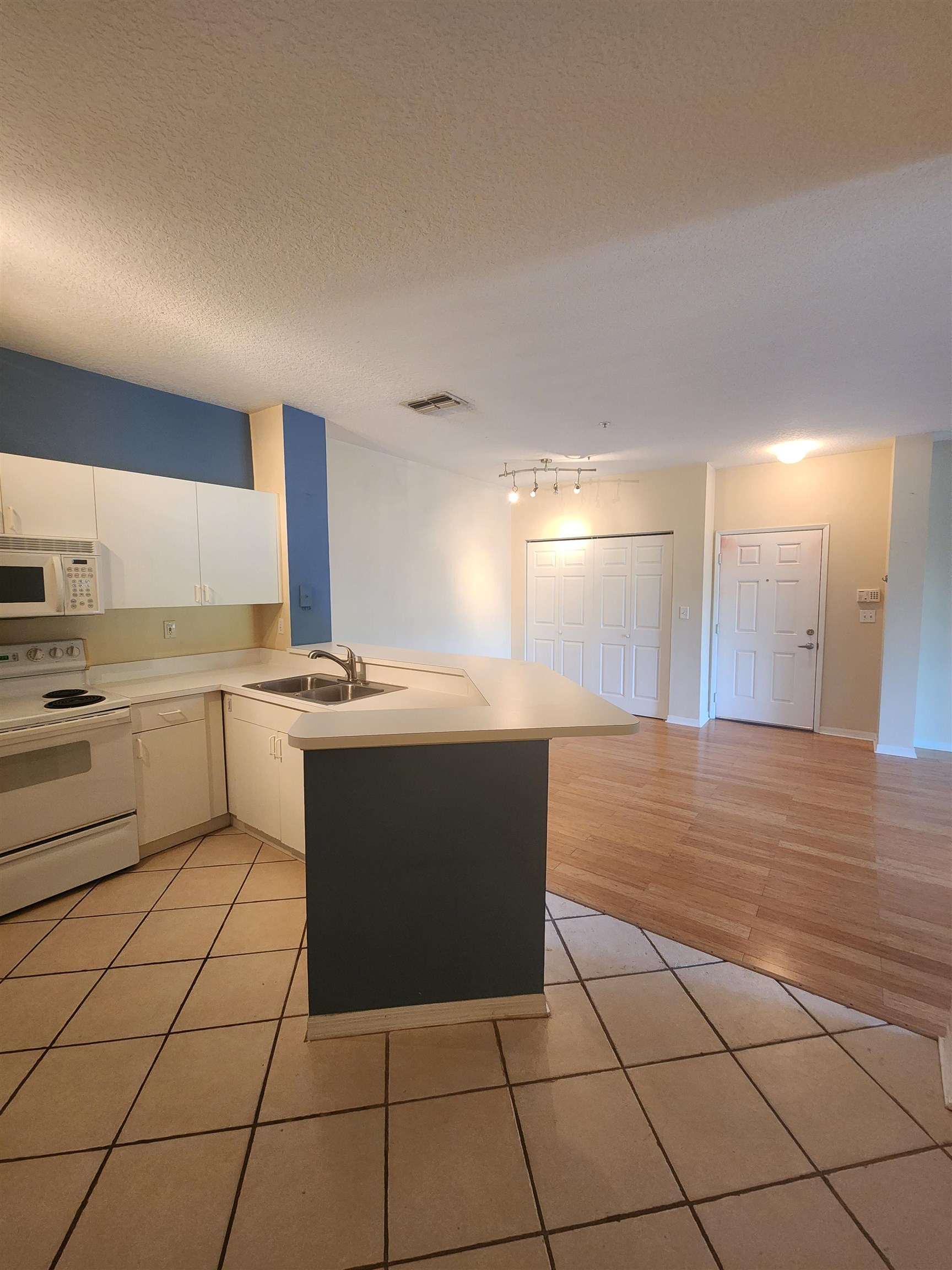 510 Florida Club Boulevard, Unit 304 St. Augustine, FL 32084 - Photo 7 of 24 a kitchen with a sink a counter top space cabinets and stainless steel appliances