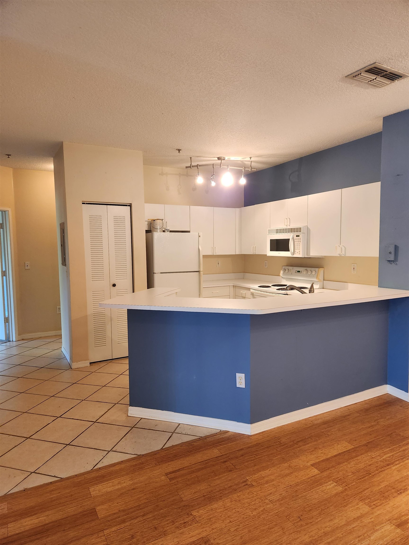 510 Florida Club Boulevard, Unit 304 St. Augustine, FL 32084 - Photo 8 of 24 a view of kitchen with granite countertop cabinets and a sink