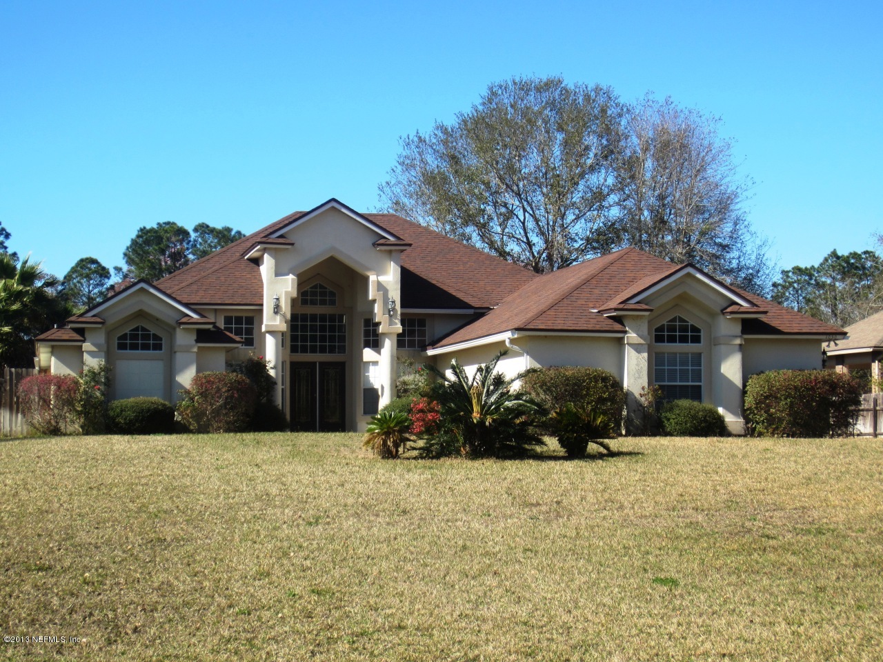 1050 Cactus Cut Road Middleburg, FL 32068 - Photo 1 of 54 a front view of a house with a yard