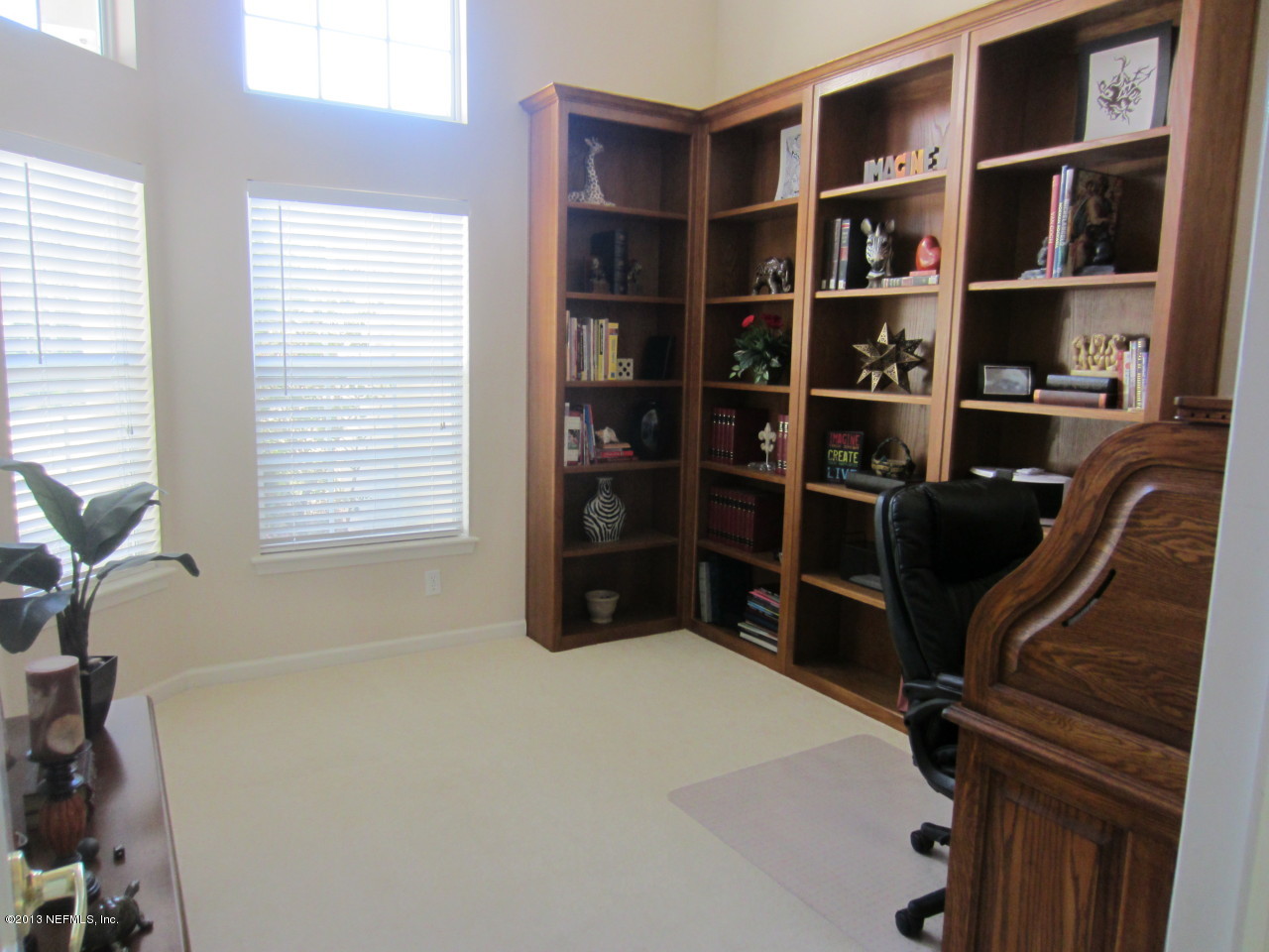 1050 Cactus Cut Road Middleburg, FL 32068 - Photo 14 of 54 a room with a bookshelf and a window