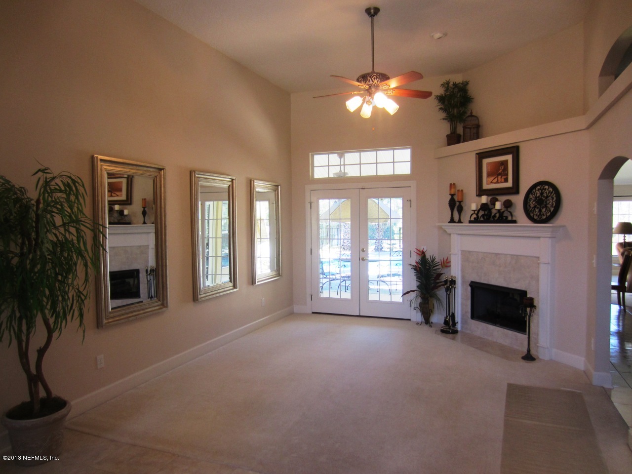 1050 Cactus Cut Road Middleburg, FL 32068 - Photo 16 of 54 a view of an empty room with a fireplace and a window