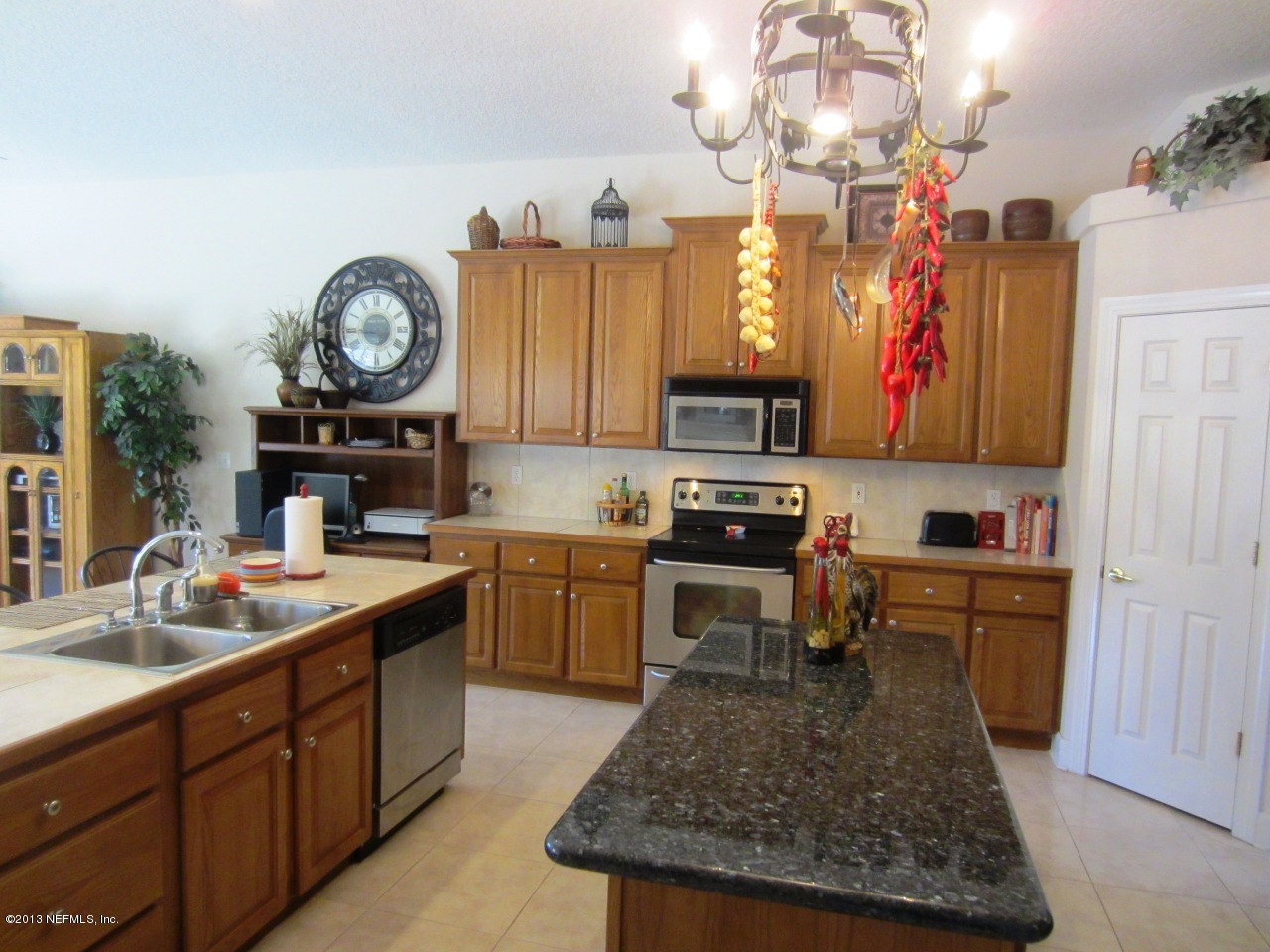 1050 Cactus Cut Road Middleburg, FL 32068 - Photo 20 of 54 a kitchen with cabinets and appliances
