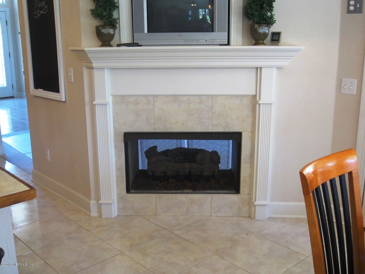 1050 Cactus Cut Road Middleburg, FL 32068 - Photo 23 of 54 a living room with a fireplace