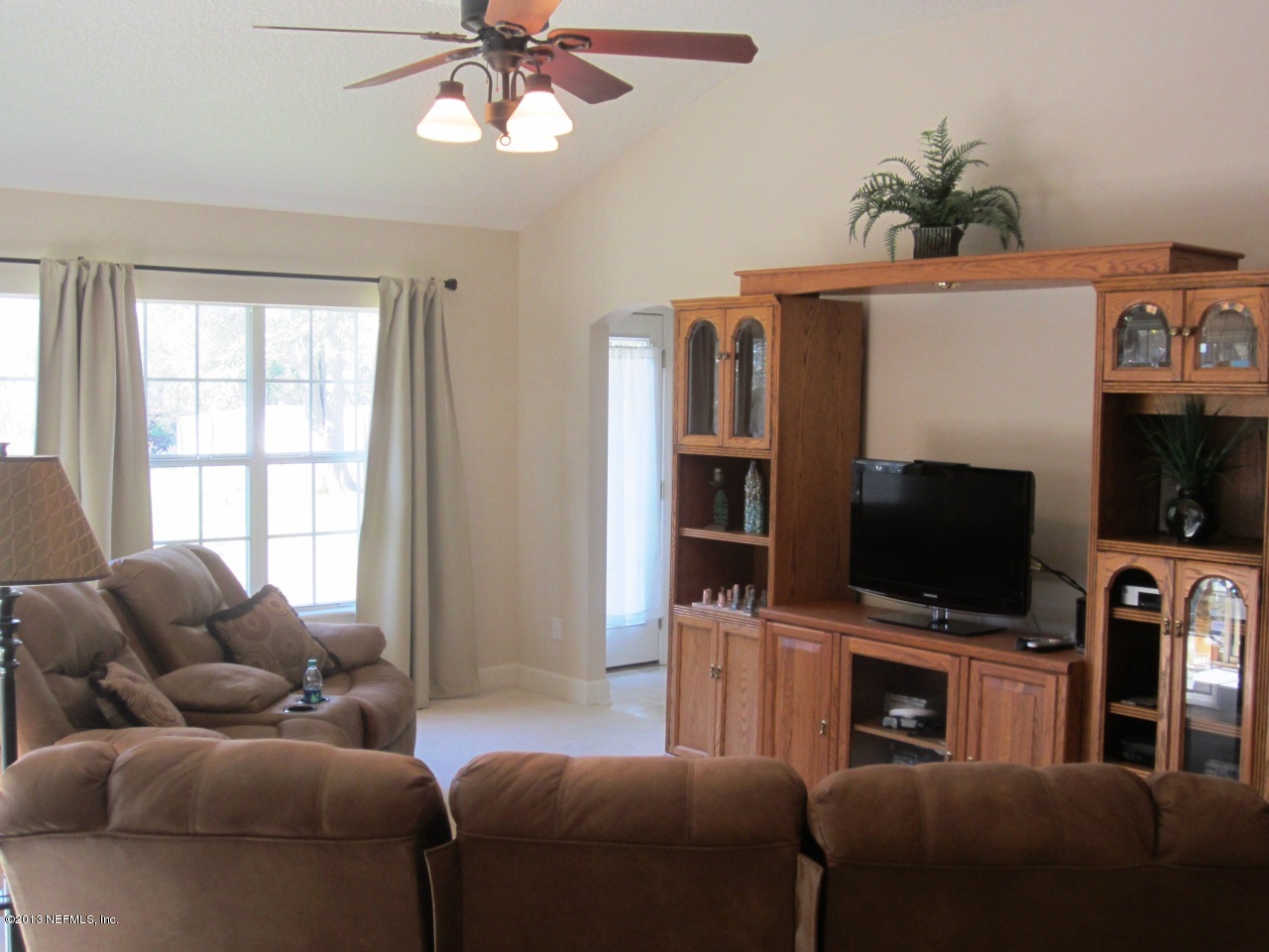1050 Cactus Cut Road Middleburg, FL 32068 - Photo 24 of 54 a living room with furniture and a flat screen tv