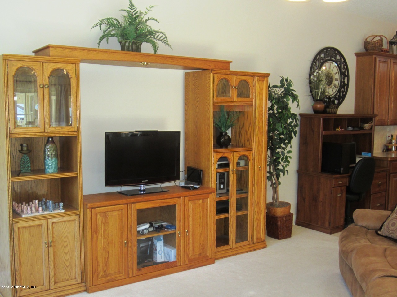 1050 Cactus Cut Road Middleburg, FL 32068 - Photo 25 of 54 a living room with furniture and a flat screen tv