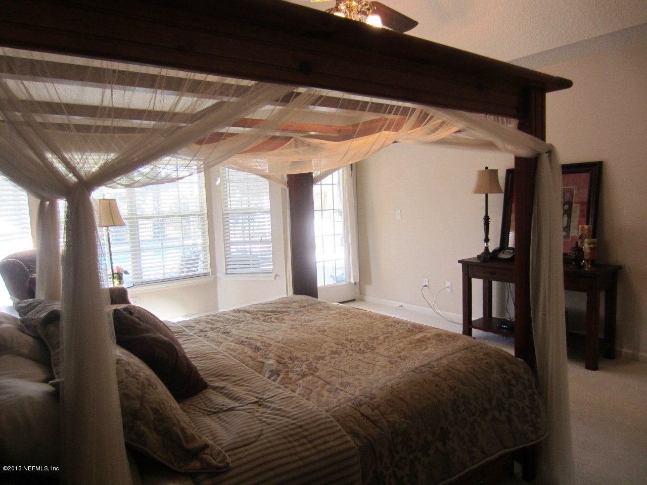 1050 Cactus Cut Road Middleburg, FL 32068 - Photo 29 of 54 a bed sitting in a bedroom next to a window