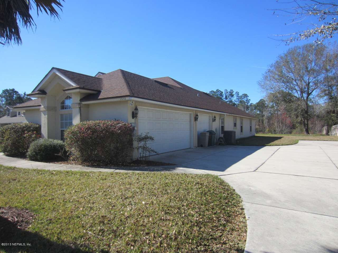 1050 Cactus Cut Road Middleburg, FL 32068 - Photo 5 of 54 a front view of a house with a yard and garage