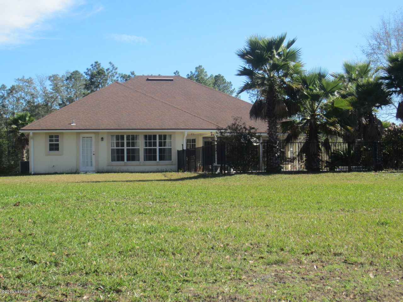1050 Cactus Cut Road Middleburg, FL 32068 - Photo 10 of 54 a front view of a house with a garden