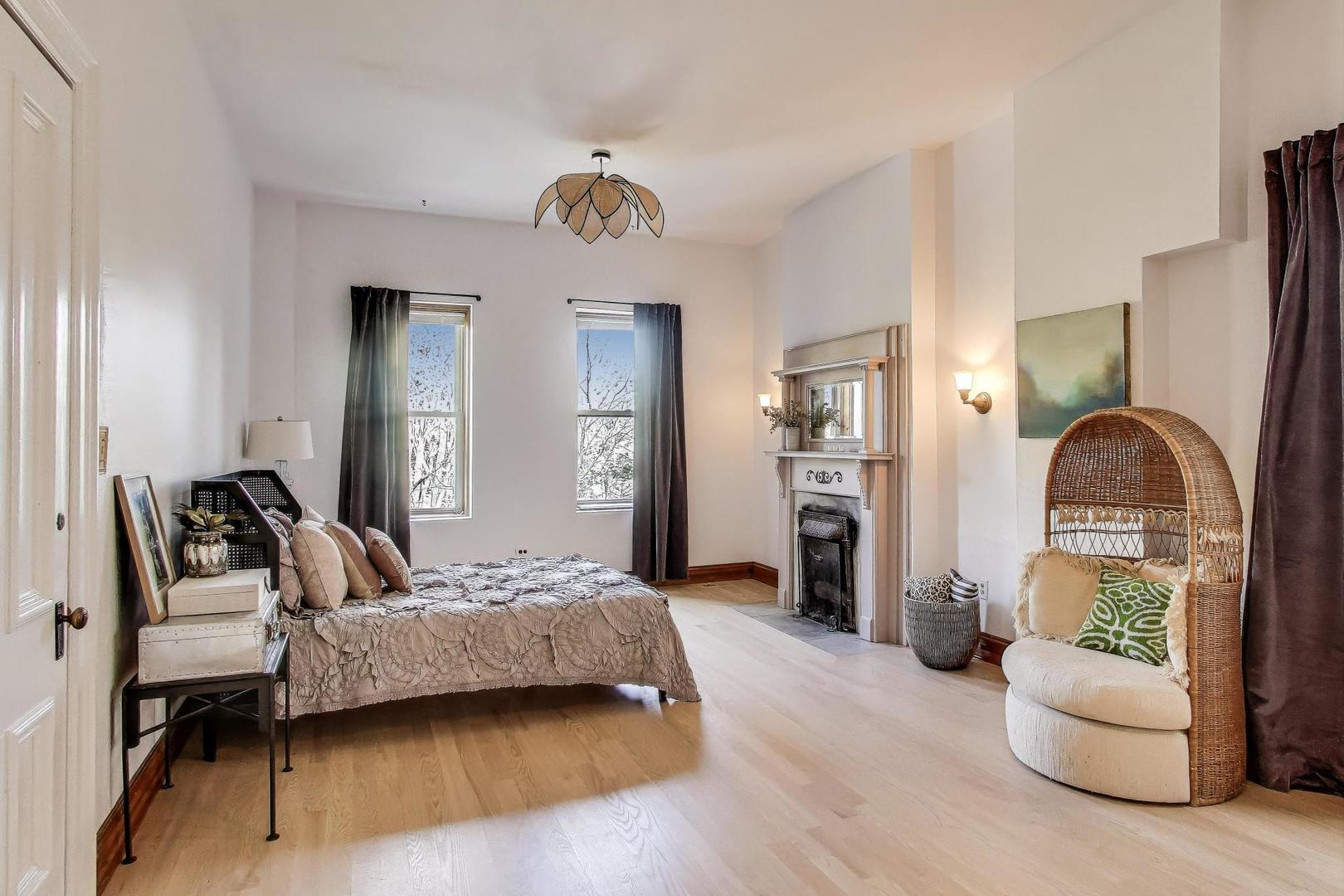 1951 West Evergreen Avenue Chicago, IL 60622 - Photo 15 of 29 a bedroom with furniture and a wooden floor