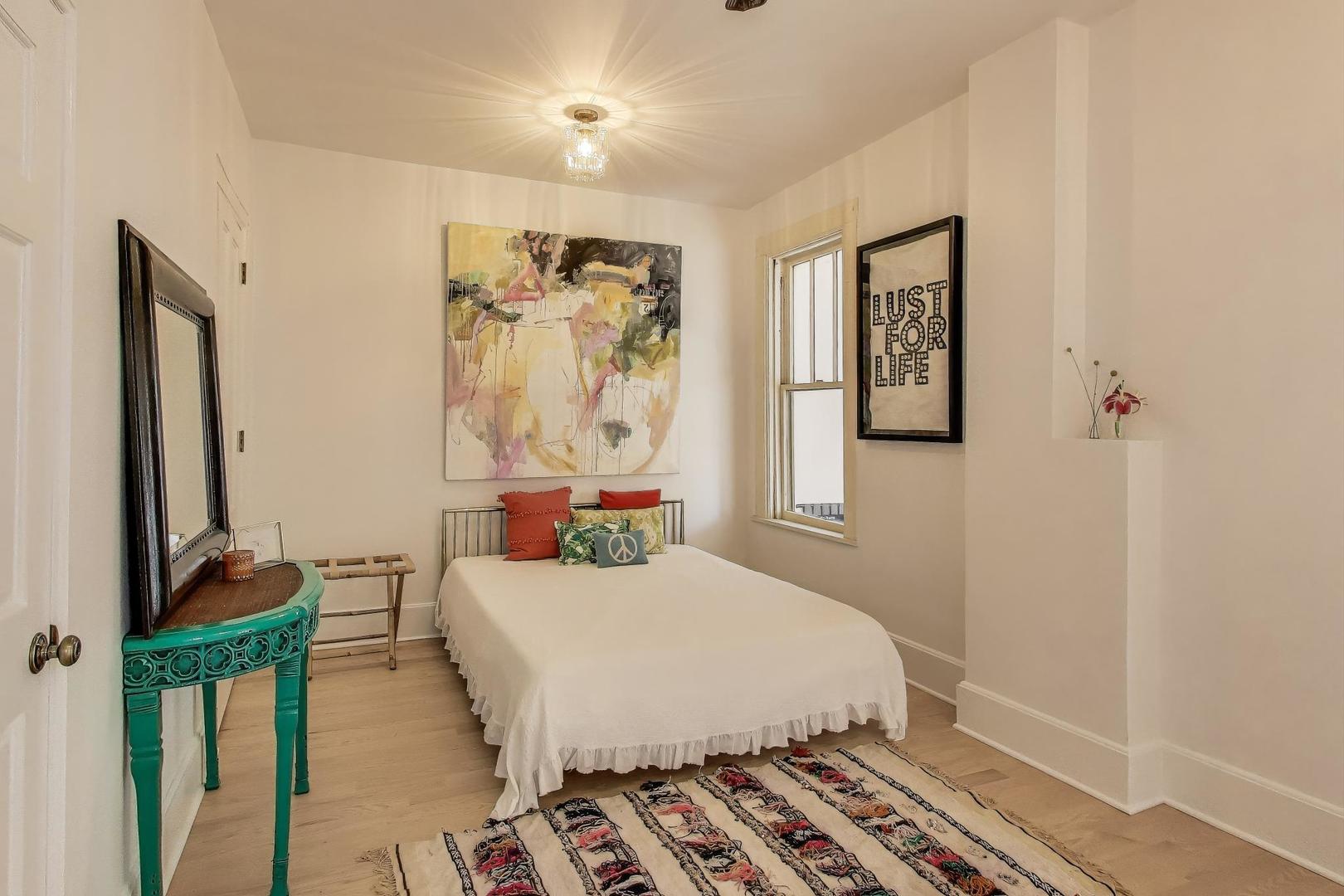 1951 West Evergreen Avenue Chicago, IL 60622 - Photo 17 of 29 a bedroom with a bed and a window
