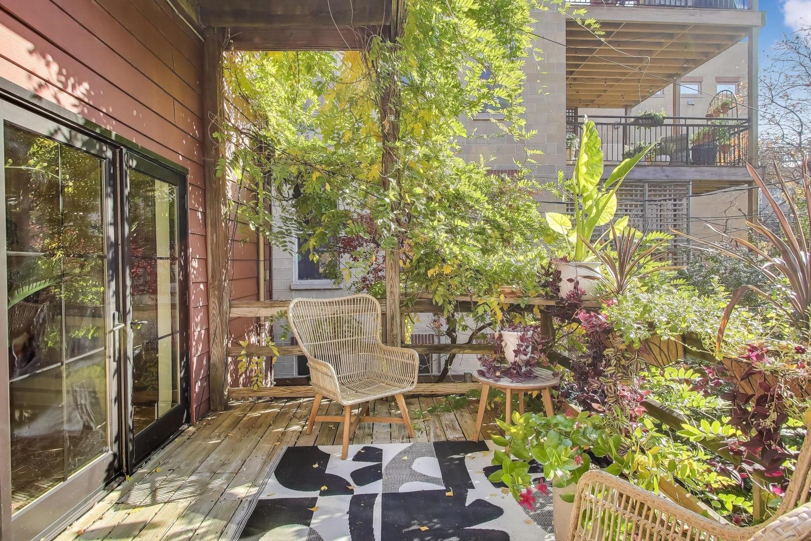 1951 West Evergreen Avenue Chicago, IL 60622 - Photo 22 of 29 a view of a patio with table and chairs and floor to ceiling window