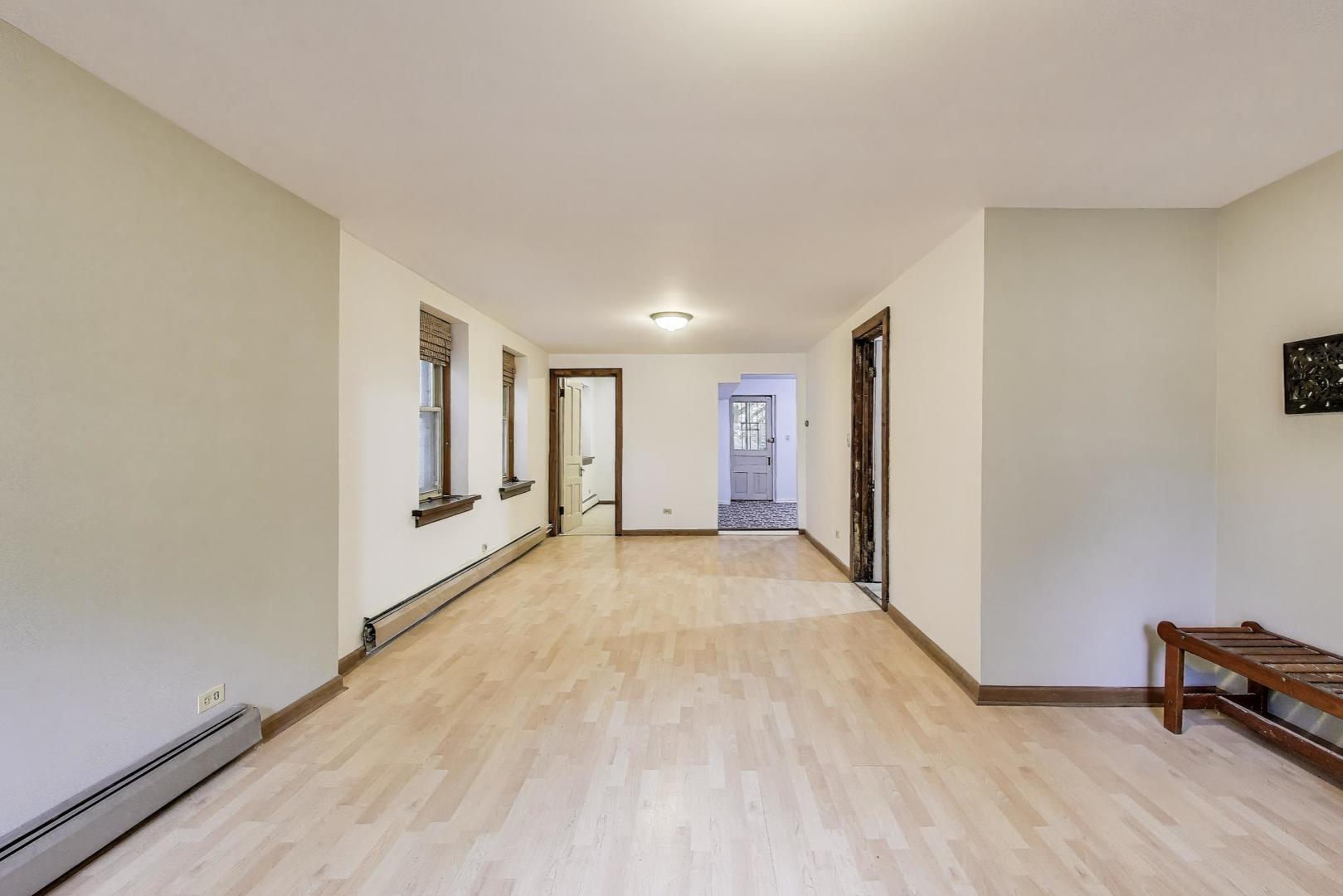 1951 West Evergreen Avenue Chicago, IL 60622 - Photo 23 of 29 a view of a room with wooden floor and a window