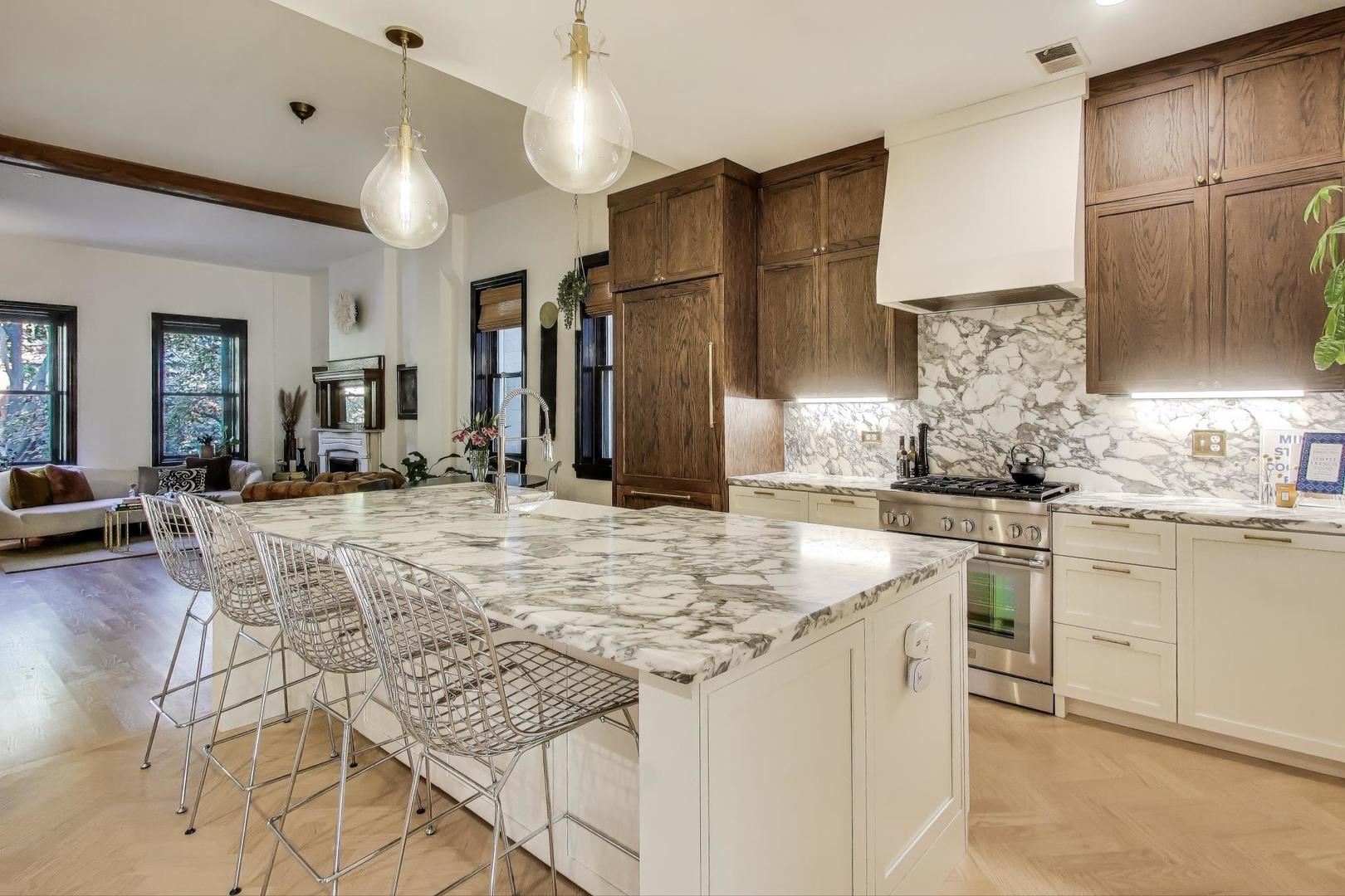 1951 West Evergreen Avenue Chicago, IL 60622 - Photo 8 of 29 a kitchen with stainless steel appliances granite countertop a sink and cabinets