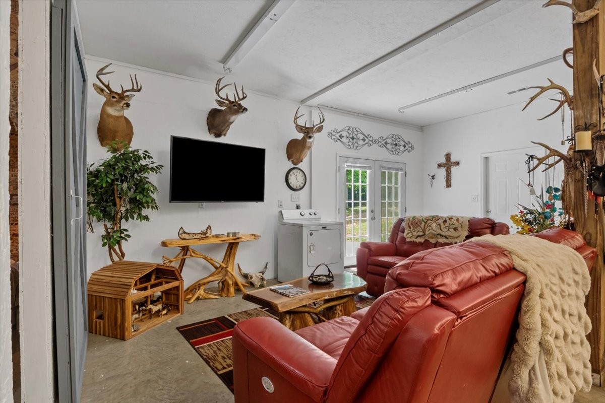 100 Croff Lane McEwen, TN 37101 - Photo 11 of 63 a living room with furniture and a flat screen tv