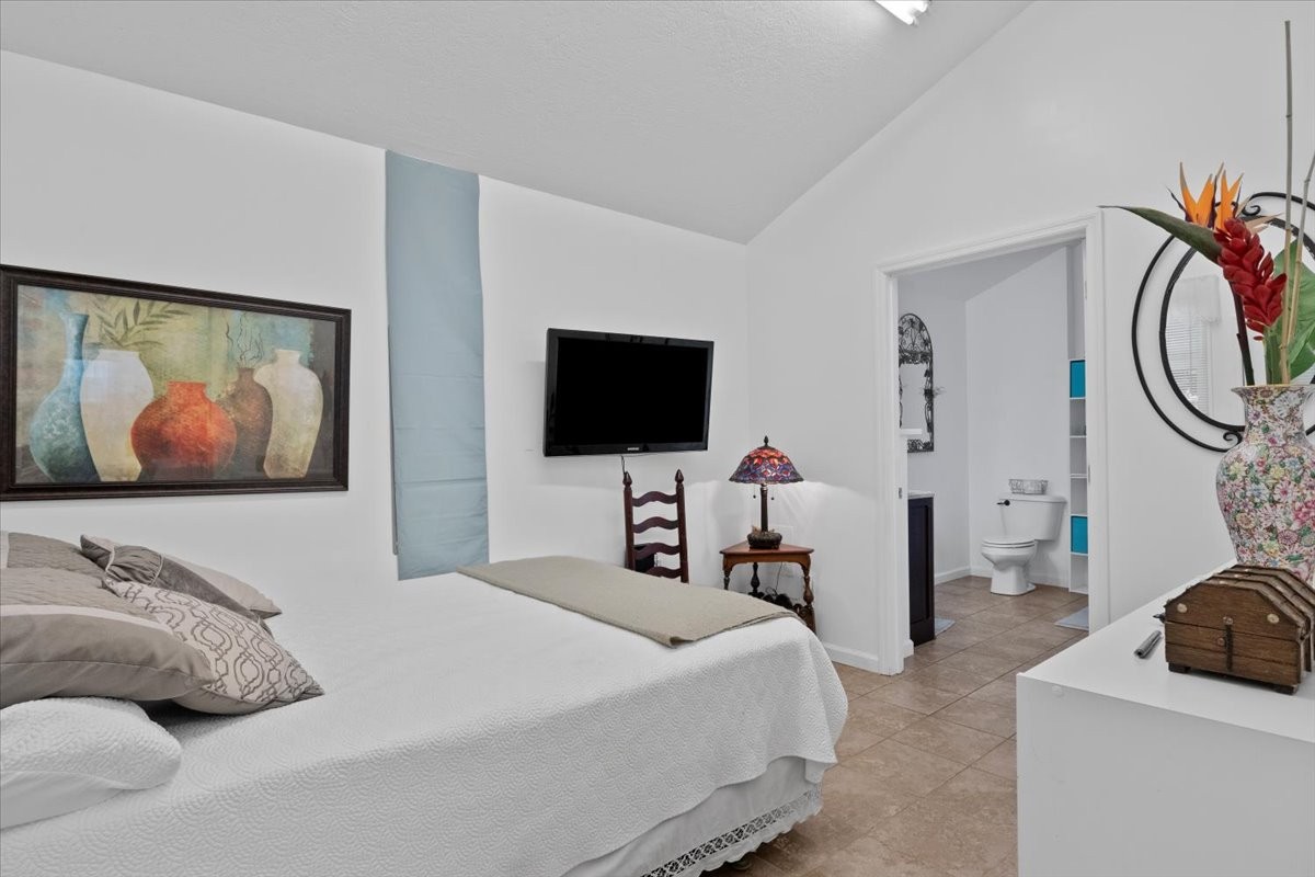 100 Croff Lane McEwen, TN 37101 - Photo 14 of 63 a bedroom with a bed and a flat screen tv