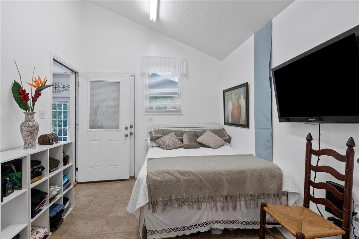 100 Croff Lane McEwen, TN 37101 - Photo 15 of 63 a bedroom with a bed a flat screen tv and a window