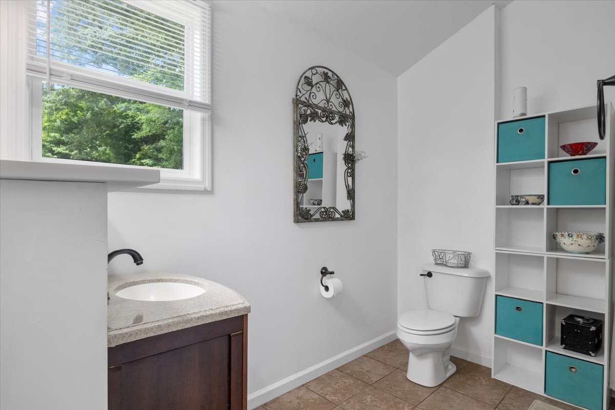 100 Croff Lane McEwen, TN 37101 - Photo 18 of 63 a bathroom with a toilet sink and mirror