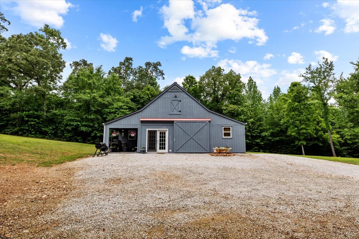 100 Croff Lane McEwen, TN 37101 - Photo 30 of 63 a front view of a house with a yard and trees