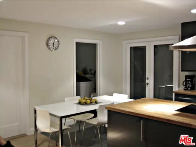 a kitchen with a table and chairs
