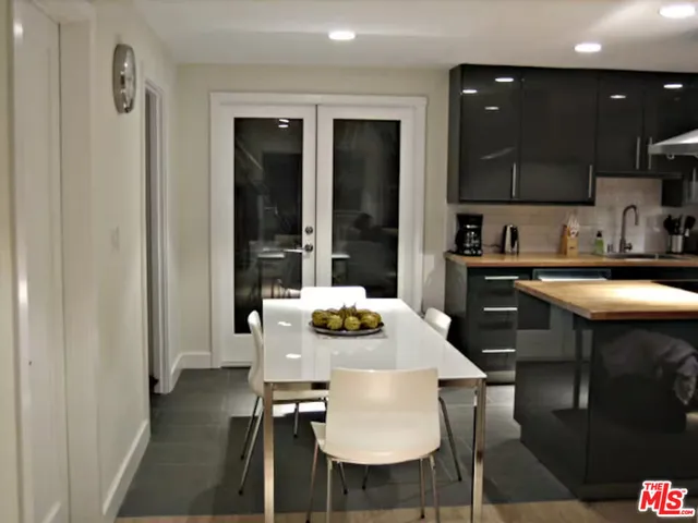a kitchen with a table and chairs