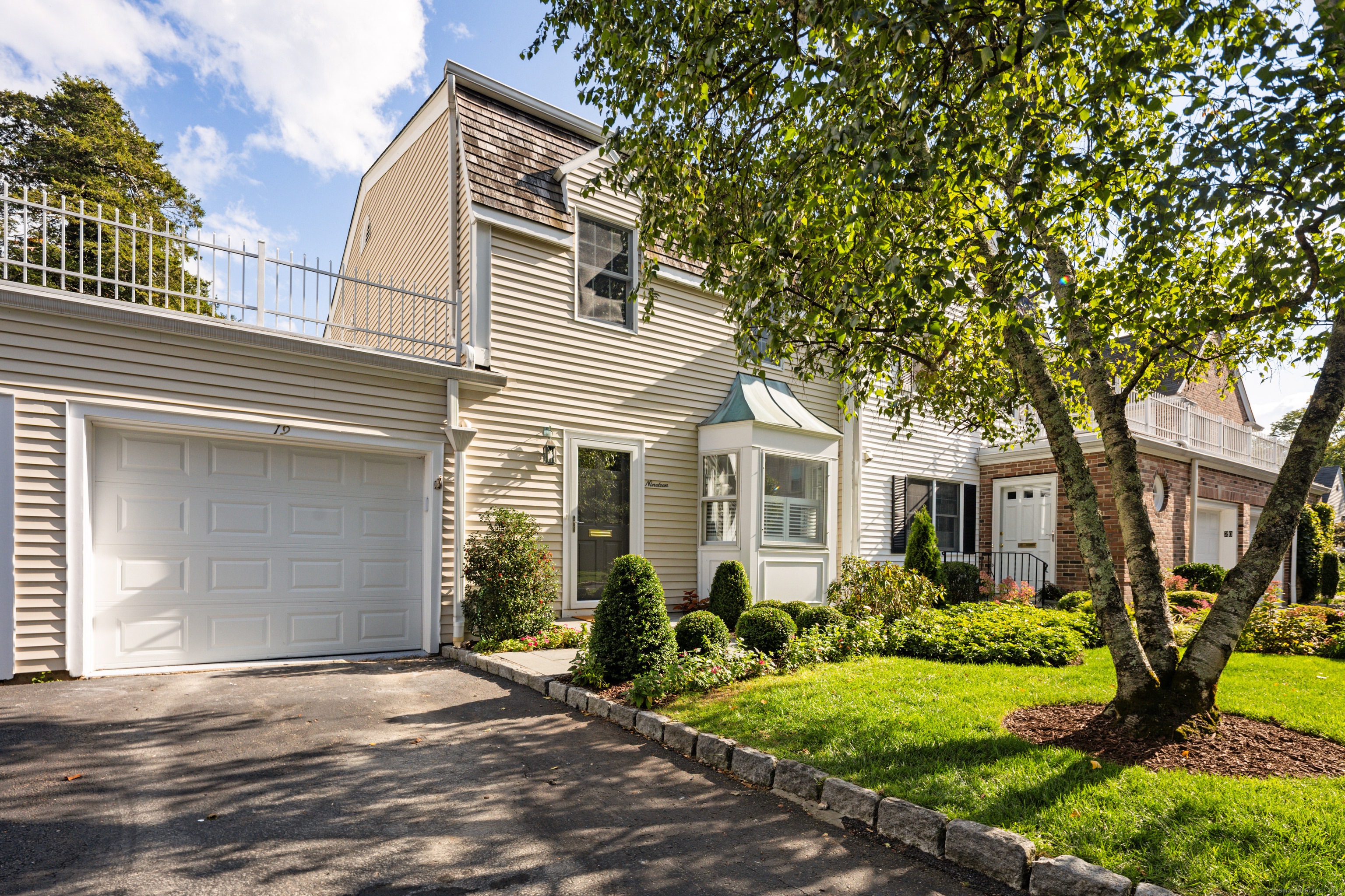 a front view of a house with garden