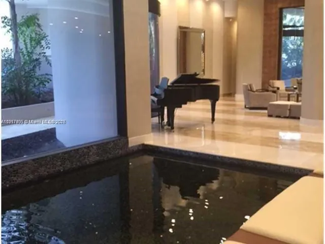 a kitchen with a sink and a mirror