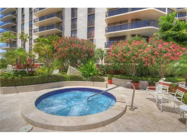 a view of a swimming pool with sitting area