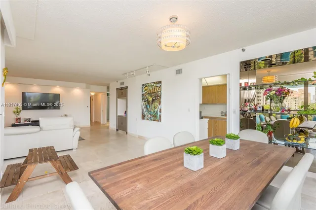 a kitchen with a table and chairs