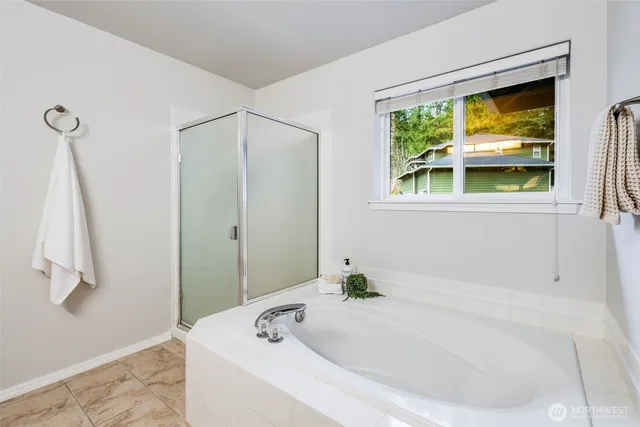 a spacious bedroom with a bed and a cabinets