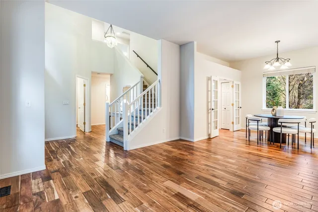 a view of a livingroom with furniture and hardwood floor