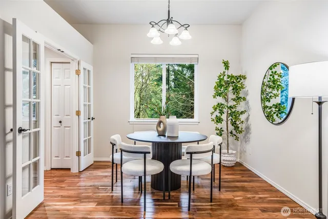 a view of a dining room with furniture window and wooden floor