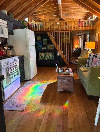 a view of storage and utility room with wooden floor