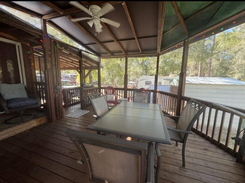 25235 142nd Lane Northeast, Unit 185 Fort McCoy, FL 32134 - Photo 15 of 49 a view of a dining room with furniture window and outside view