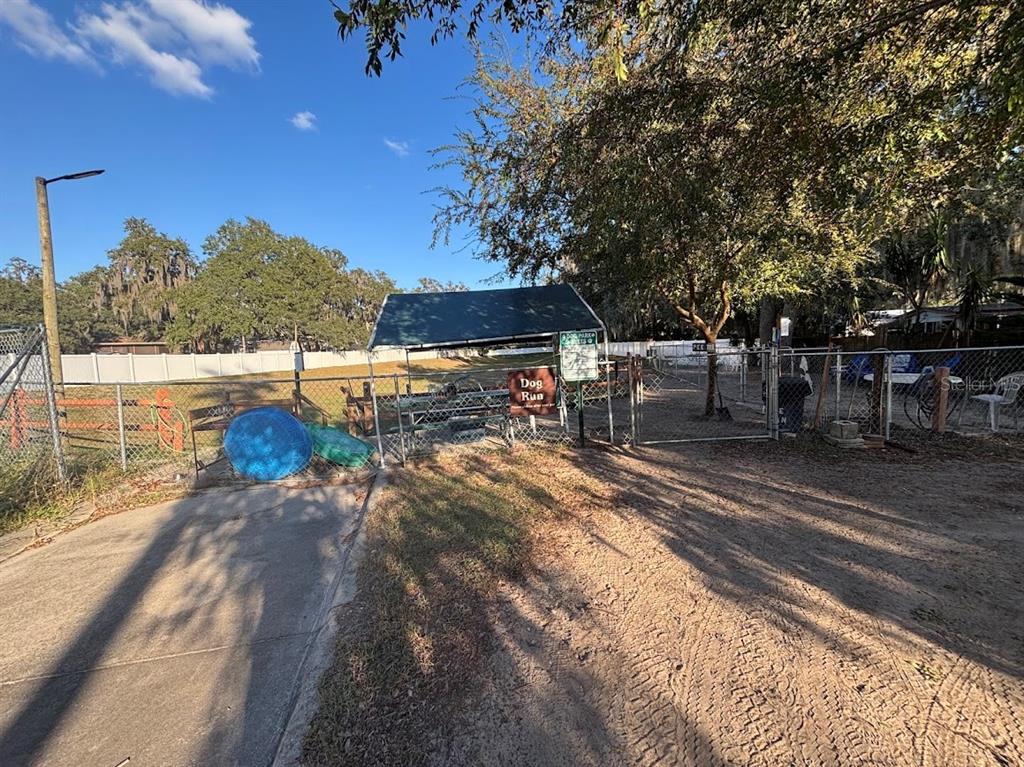 25235 142nd Lane Northeast, Unit 185 Fort McCoy, FL 32134 - Photo 28 of 49 a view of a yard