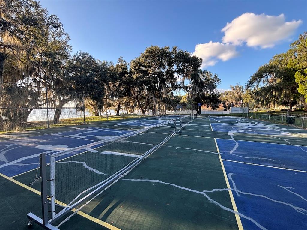 25235 142nd Lane Northeast, Unit 185 Fort McCoy, FL 32134 - Photo 34 of 49 a view of a tennis court