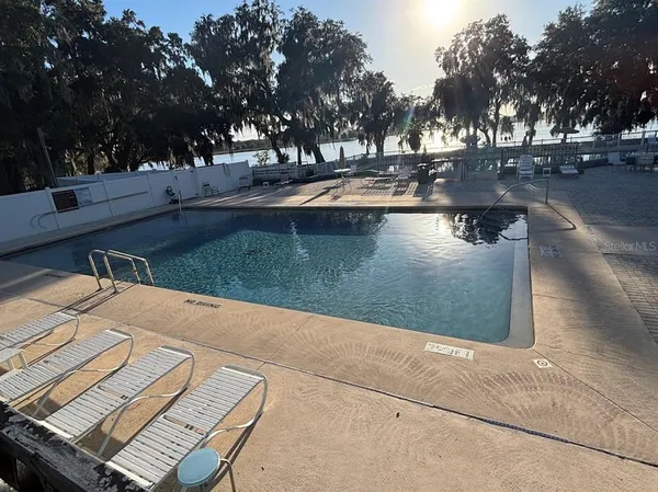 a view of a swimming pool with an outdoor space