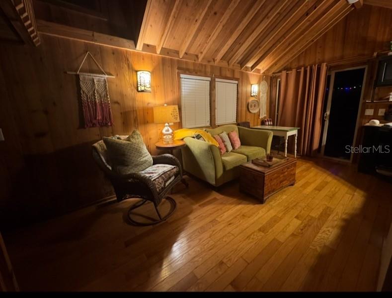 25235 142nd Lane Northeast, Unit 185 Fort McCoy, FL 32134 - Photo 5 of 49 a living room with furniture a flat screen tv and a fireplace