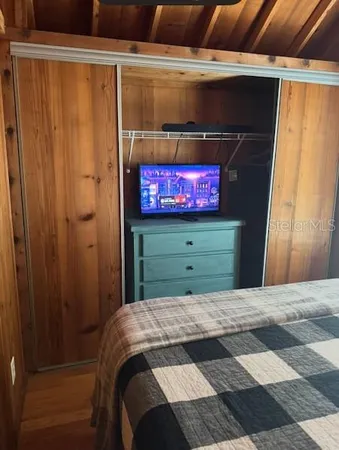 a bedroom with a bed and a dresser