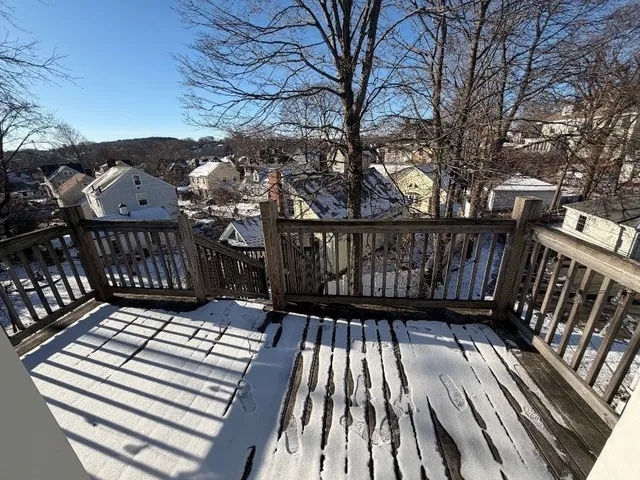 a view of balcony with wooden floor