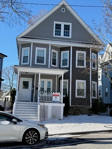 a front view of a house with parking space