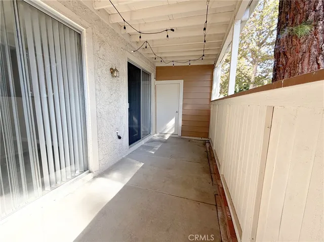 a view of a garage with wooden floor