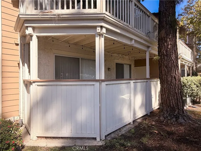 a view of a house with a window and wooden door