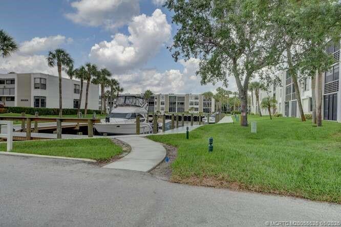 1950 Southwest Palm City Road, Unit 3209 Stuart, FL 34994 - Photo 47 of 64 Lush Yacht club grounds.
