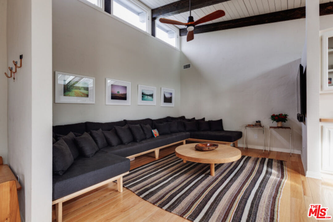 3629 Serra Road Malibu, CA 90265 - Photo 15 of 18 a living room with furniture and a rug