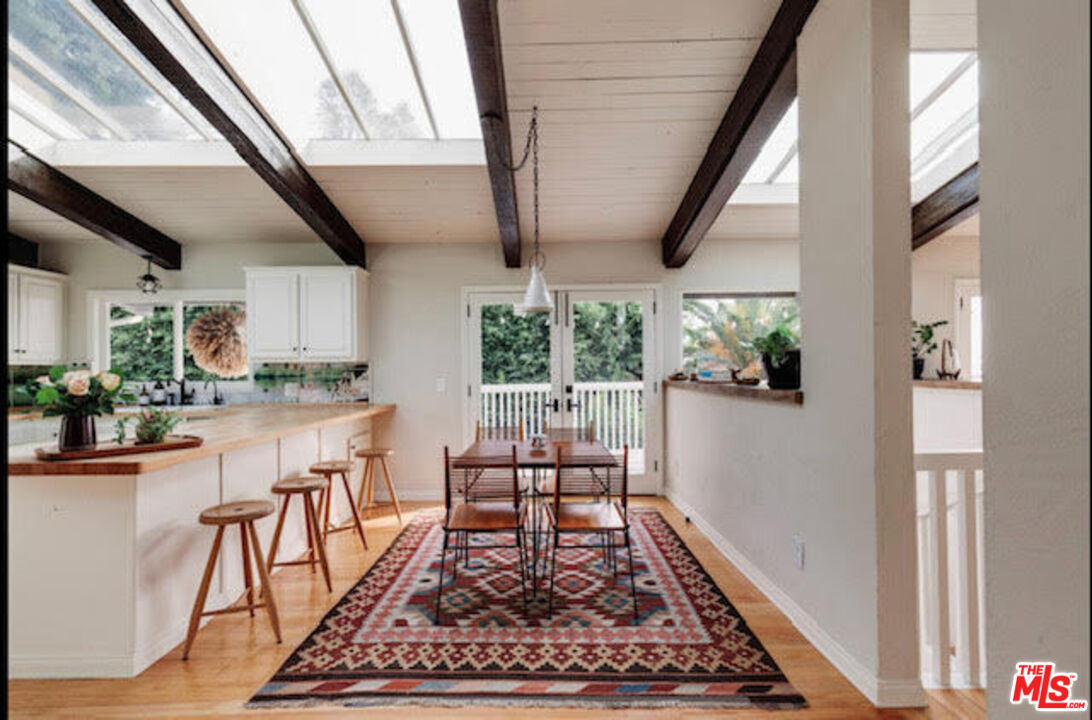 3629 Serra Road Malibu, CA 90265 - Photo 4 of 18 a room with wooden floor and a rug