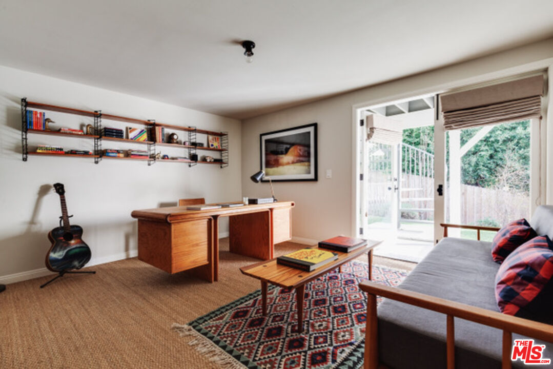 3629 Serra Road Malibu, CA 90265 - Photo 6 of 18 a living room with furniture and a window