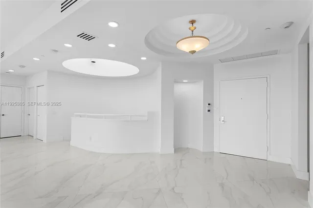 a view of large living room with a large window