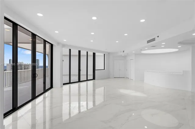 a view of a hallway with windows